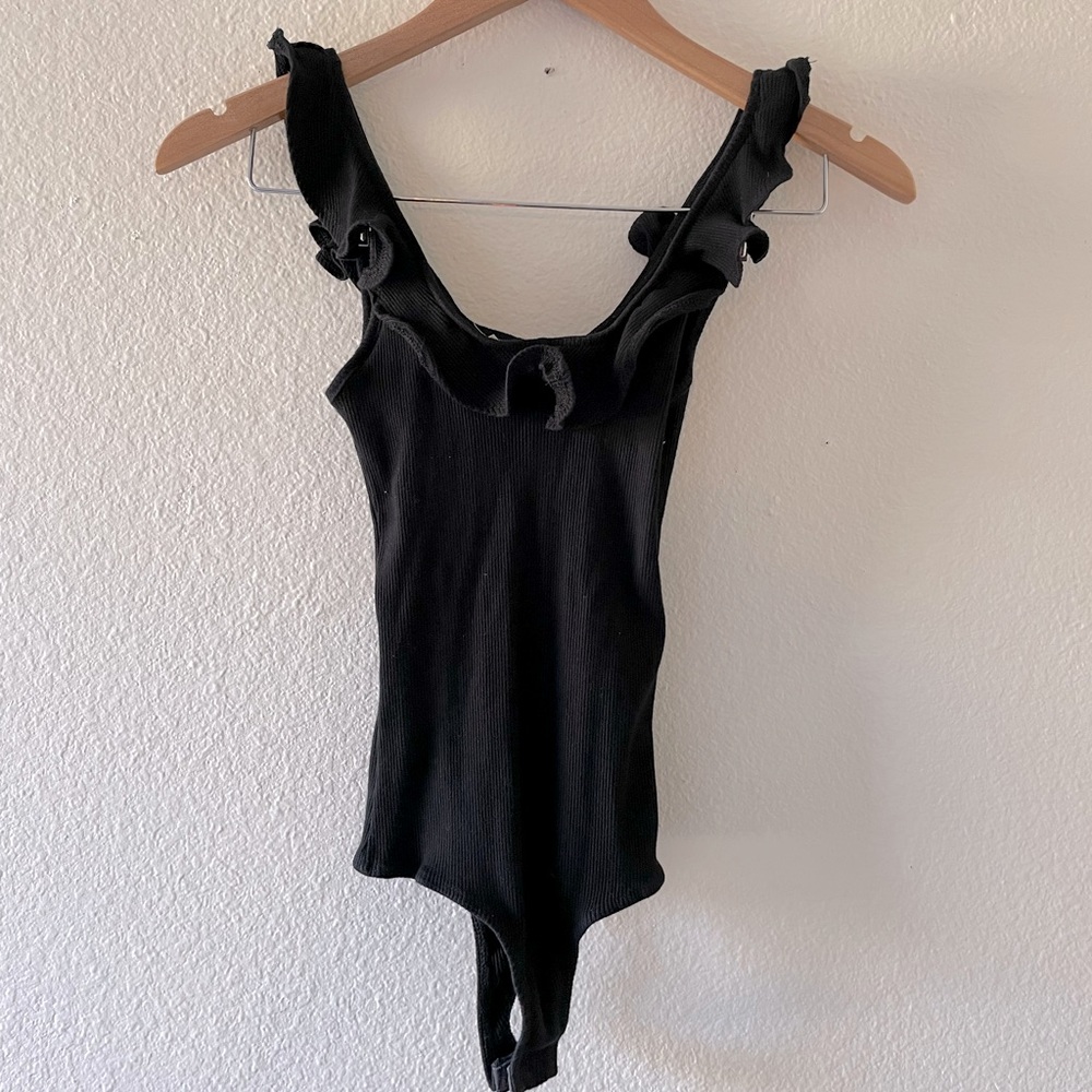 Black bodysuit with ruffle